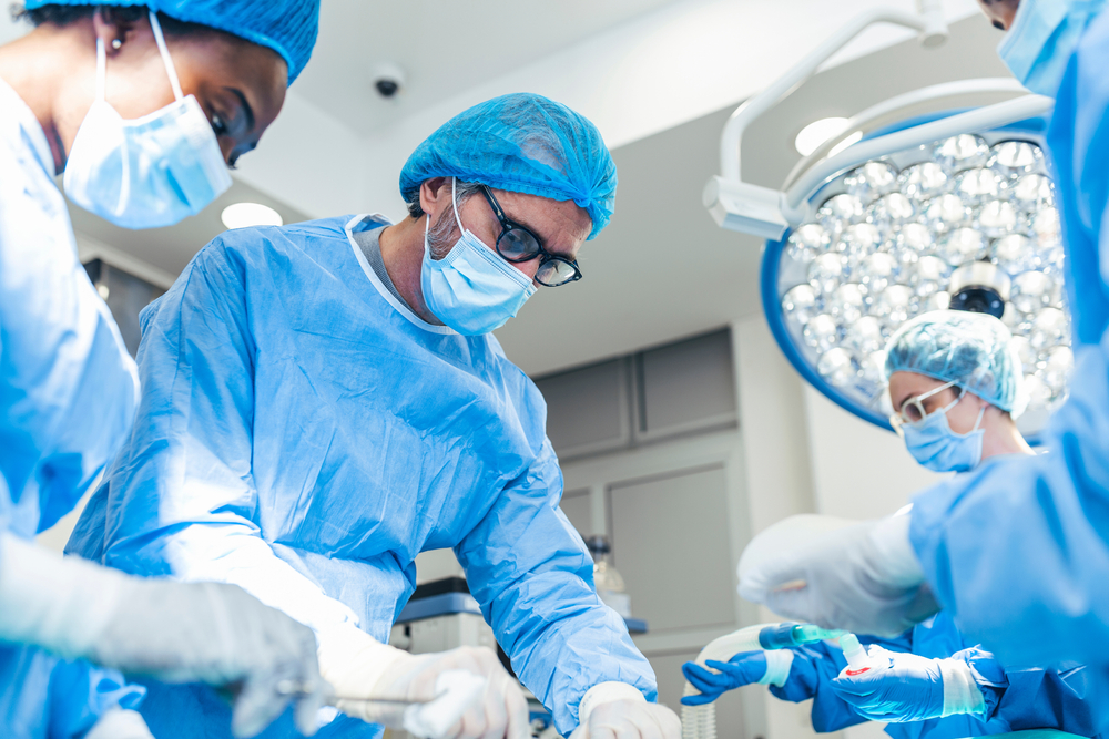 doctors and nurses performing in an operating room